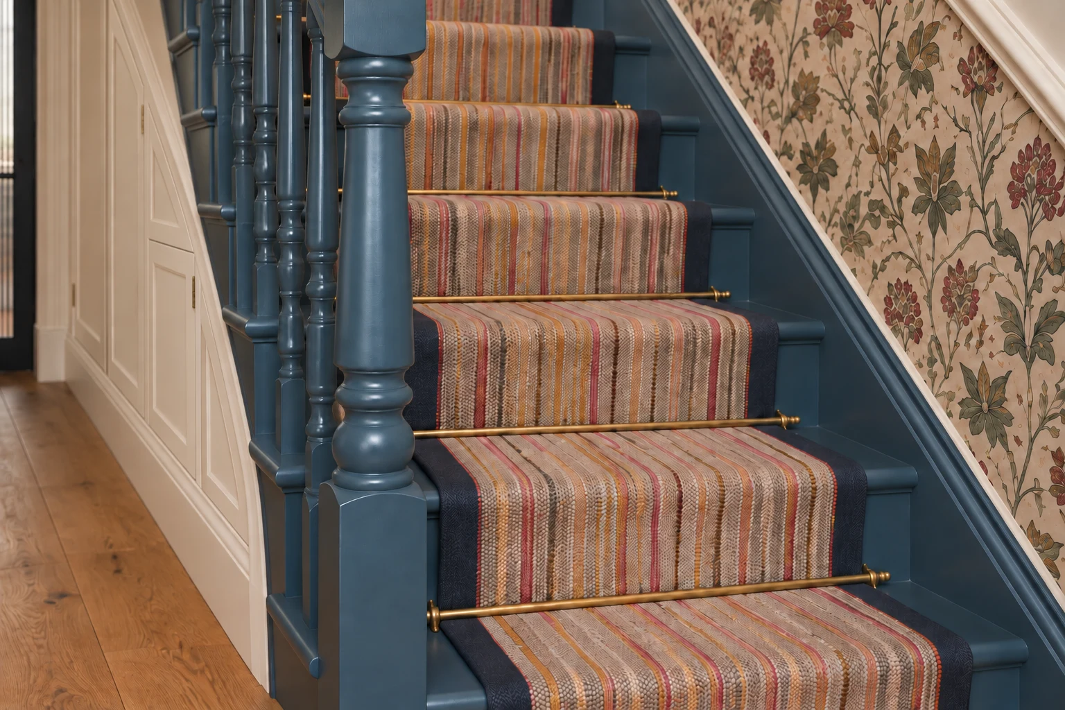 Family residence in Epsom Downs: Ground-floor staircase with fitted understairs storage.