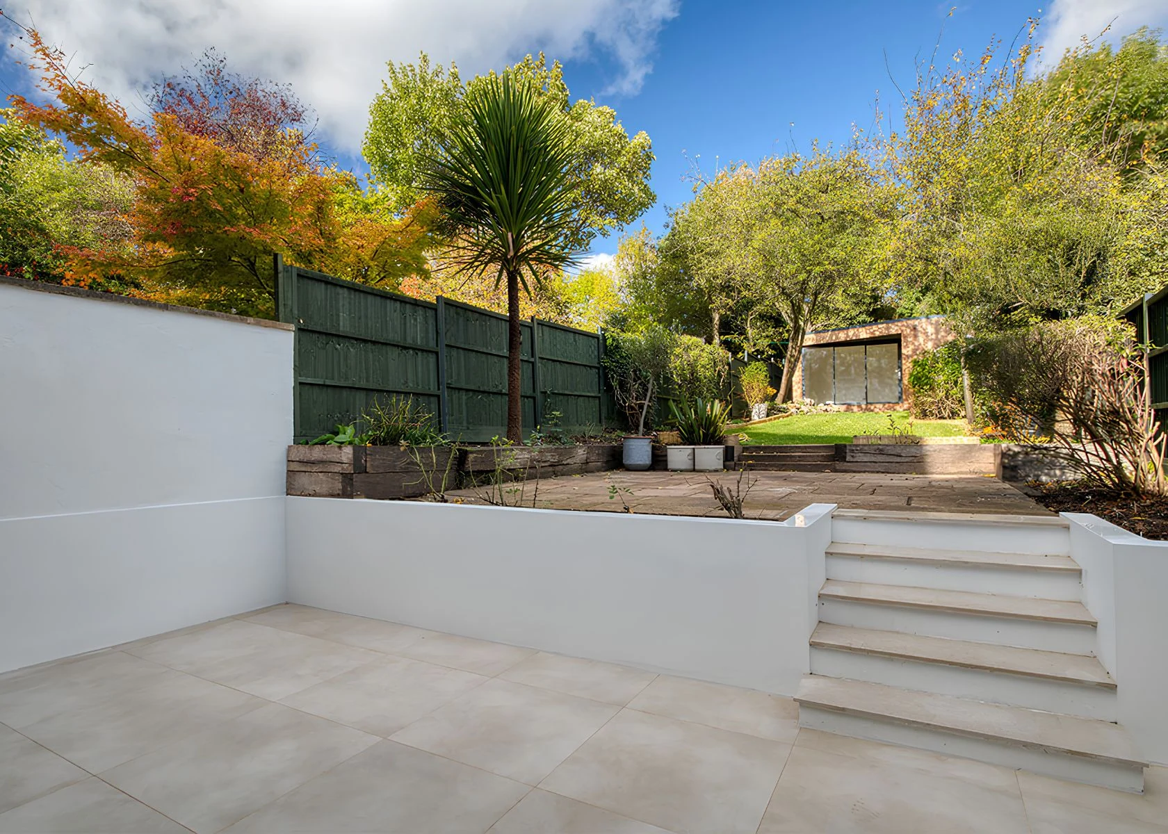 Fernhurst Road: The paved terrace and steps to the garden.
