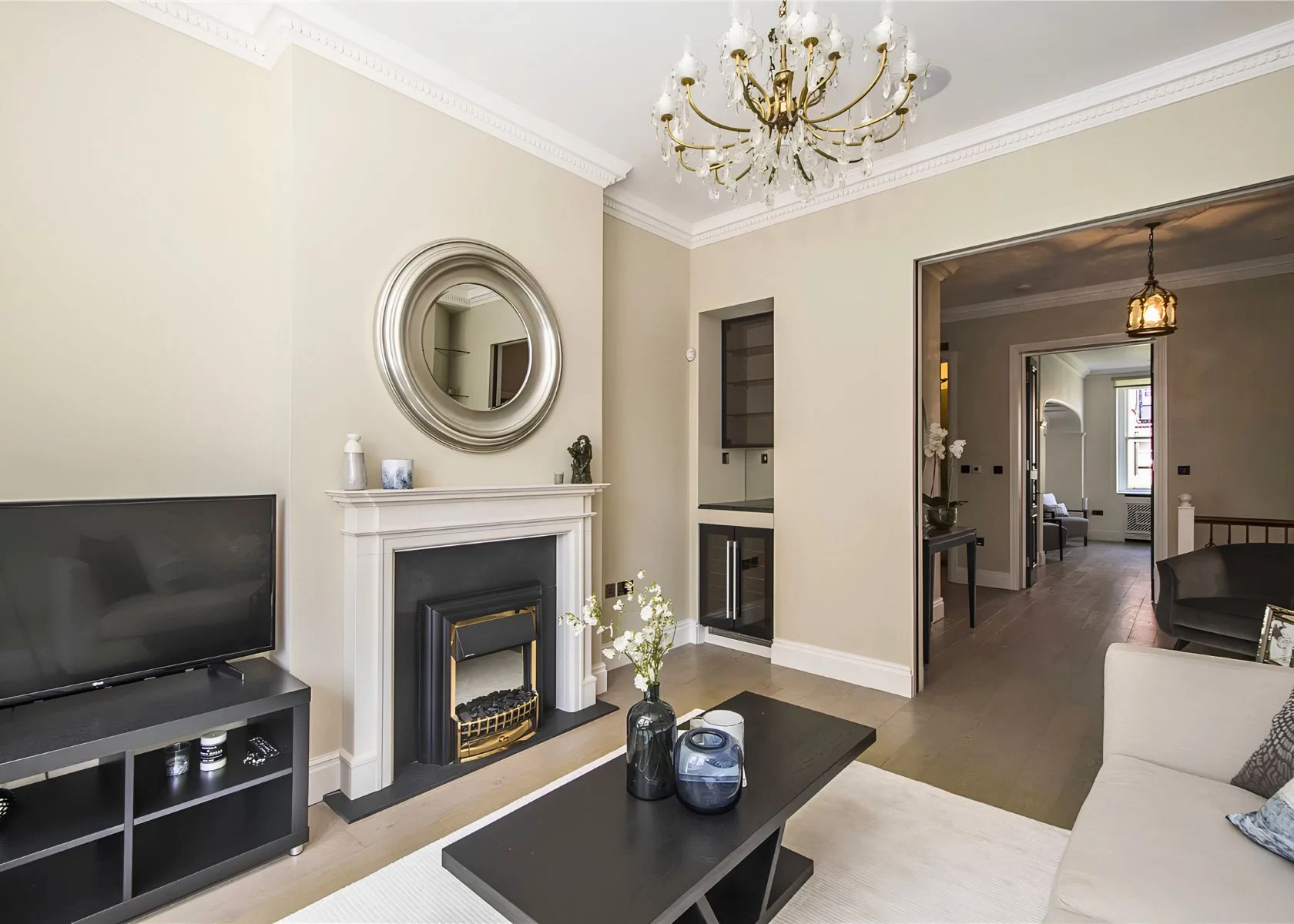 Putney: The living room connects through to the kitchen and dining area.