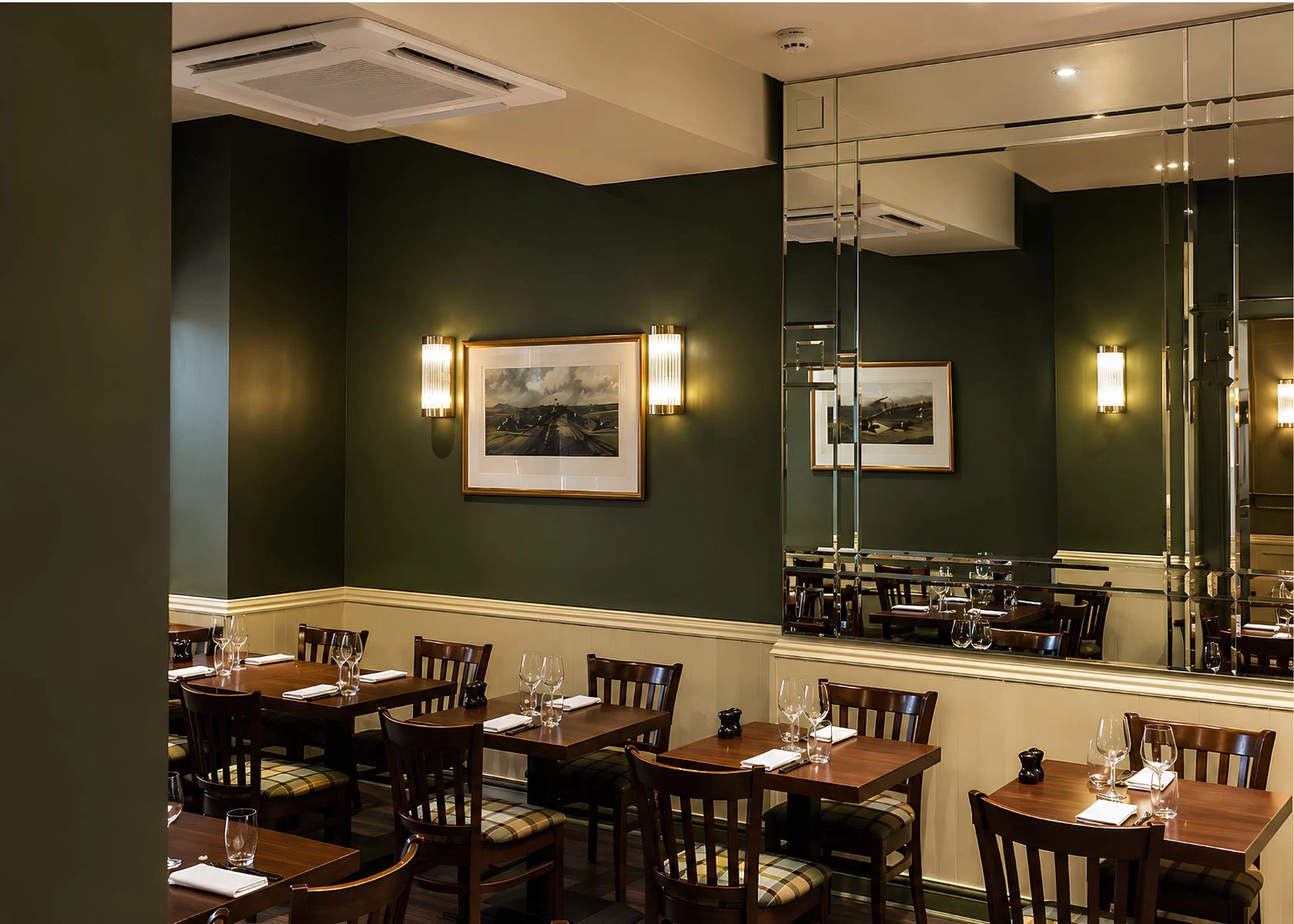 Rowley’s: Ceiling and wall treatments above the dining tables.